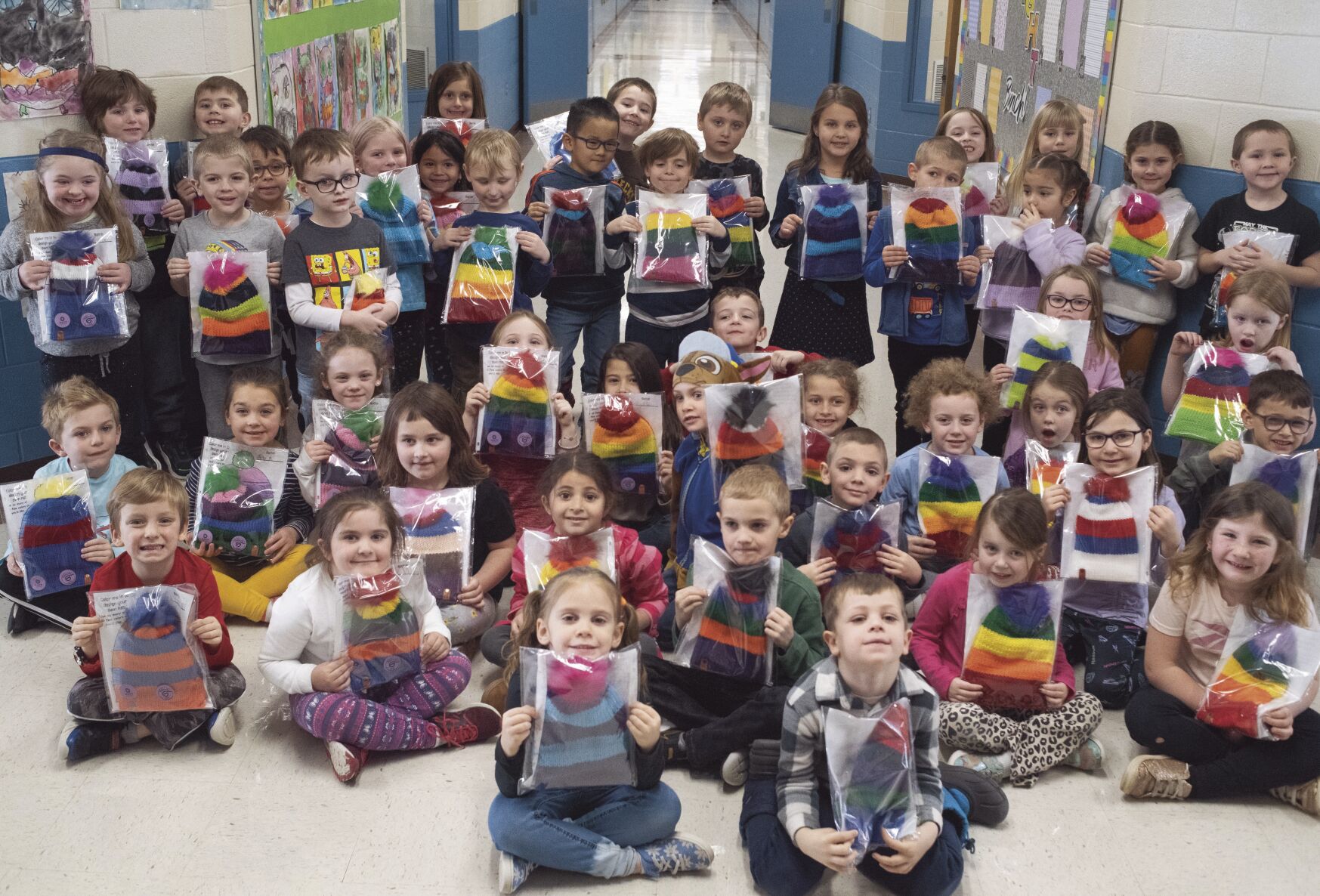 Mom creates custom winter hats for Elm Street School kindergarteners